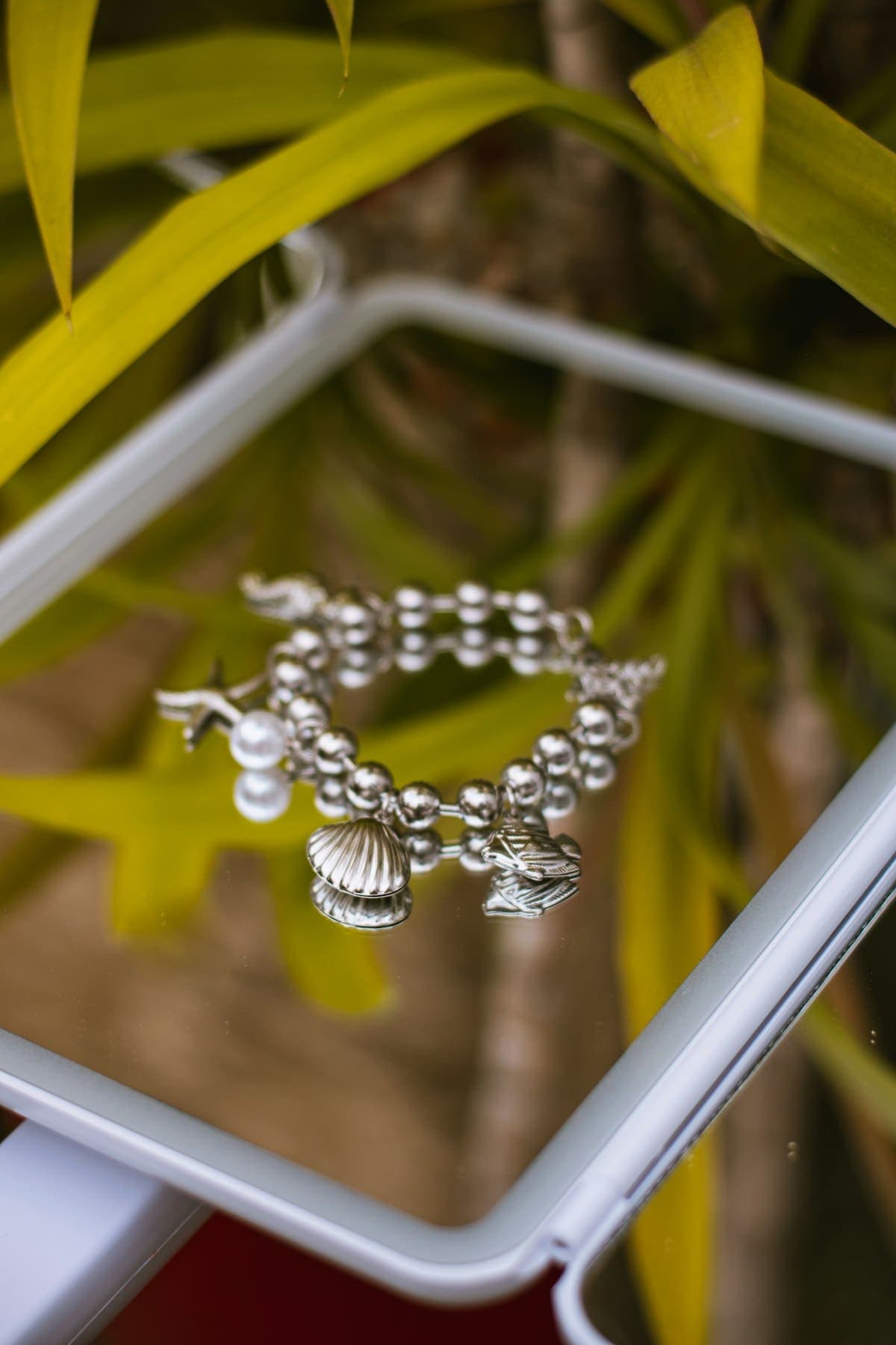 Kavya Charm Bracelet in silver tone